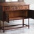 This oak sideboard with a mirrored top was made in England around 1920–1930 and follows the Jacobean Revival, which...