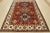 A tribal Caucasian Kazak rug hand-knotted with an all-wool pile on a cotton foundation. This oriental rug features...