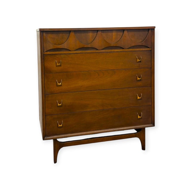 This authentic mid-century modern tallboy chest from the iconic Broyhill Brasilia collection features rich walnut...