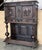 20th century Spanish hand carved Renaissance raised cabinet was rendered from dense, old-growth quarter sawn walnut,...