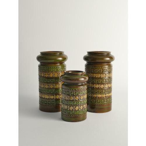 These stoneware vases, crafted by aldo londi and produced by bitossi in italy during the 1960s, are truly remarkable...