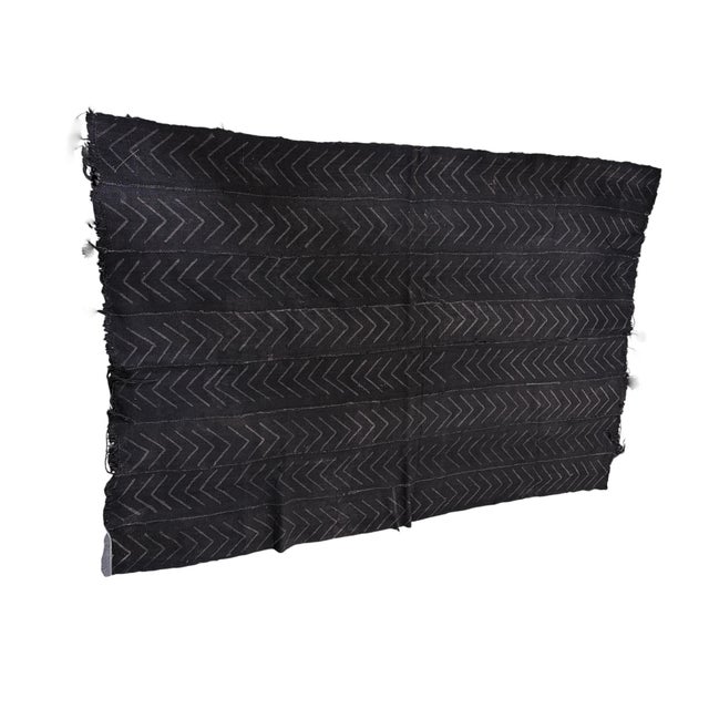 Meticulously handcrafted from 100% cotton, this authentic mud-cloth textile is created by the skilled artisans of the...