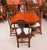 This is a fabulous high quality antique flame mahogany Regency revival twin pillar dining table and a set of ten Regency...