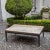 Large coffee table with a rectangular top, straight legs, and subtly rounded aprons. The newly applied anthracite gray and...