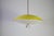 Yellow italian pendant lamp, 1950s. This elegant vintage ceiling light features a shallow saucer-shaped metal shade in...