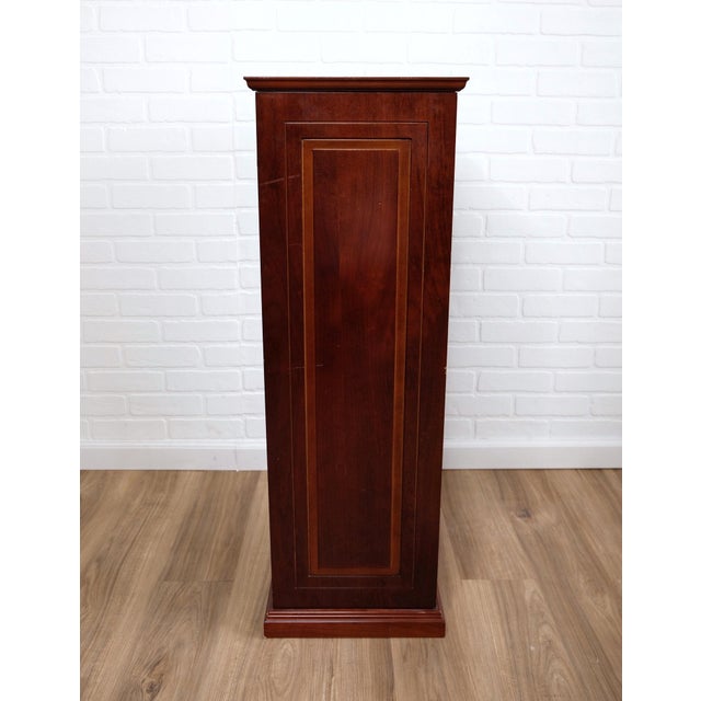 Vintage cherry wood pedestal stand with a two dozen internal storage cubby-hole compartments. No maker’s mark. Product...
