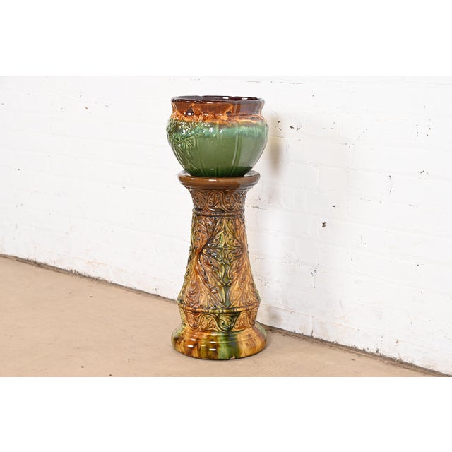 A gorgeous Arts & Crafts glazed ceramic art pottery jardiniere planter with pedestal stand By Roseville Pottery USA, Circa...