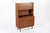 This vintage mid century Danish modern tall teak wood bookcase cabinet and secretary desk was made in Denmark circa 1960....