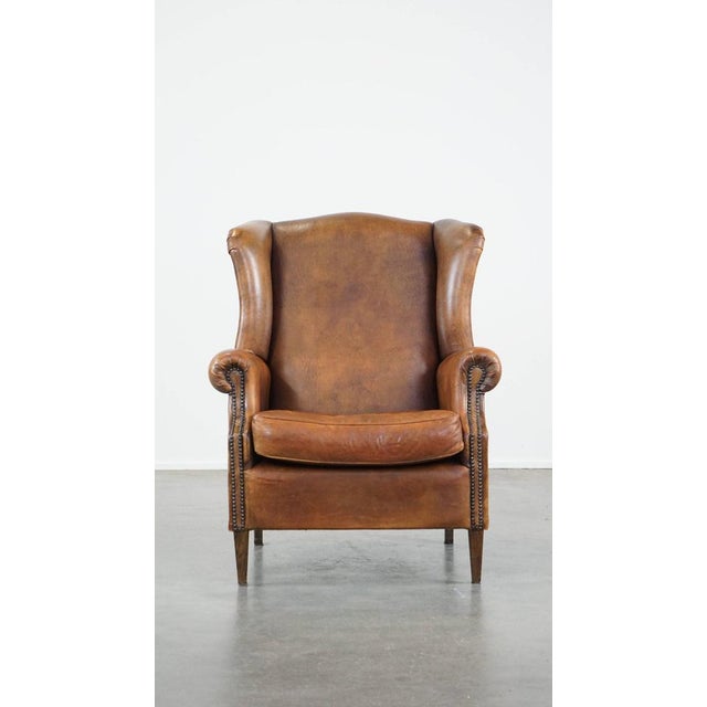 We are offering this large sheepskin wing chair with beautiful colors and a neat finish with decorative nails. This large...