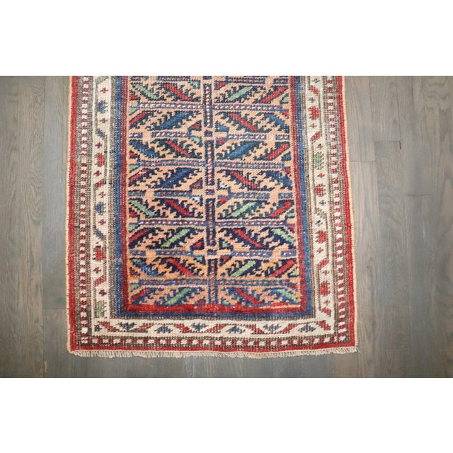 A narrow antique Persian Kurd Runner from the 2nd quarter of the 20th century