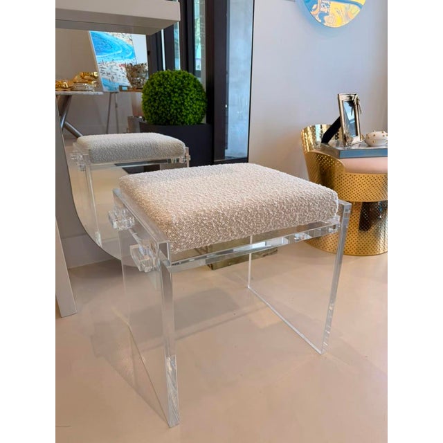 The Gerrard Accent Stool features sleek, polished acrylic frames paired with soft boucle cushions, creating an airy...