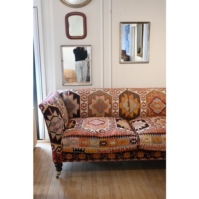 A hand made English sofa from master furniture maker George Smith. Super comfortable and upholstered throughout colorful...