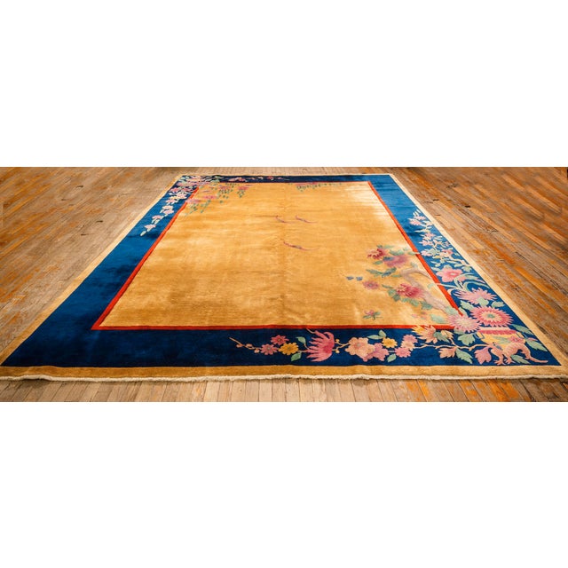 An exquisite room-sized Antique Chinese Art Deco carpet, circa 1920. Measuring 8' 10" x 11' 4", this piece features a...