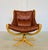 A striking Danish Mid-Century Modern swivel lounge chair designed by Svend Skipper and produced by Skippers Furniture in...