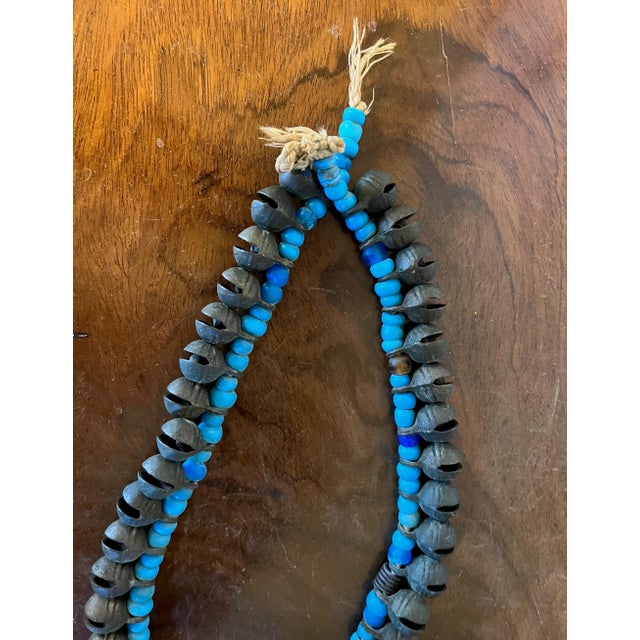 Turquoise Long Strand of Brass Bronze Bells Strung With Turquoise Glass Trade Beads For Sale - Image 8 of 13