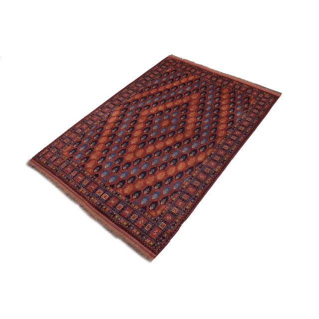 Enhance your home with the timeless craftsmanship of a hand-knotted Kargahi wool rug, celebrated for its tribal artistry,...