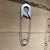 For your consideration, large wall sculpture , silver-colored metal safety pin is styled similarly to oversized fashion...