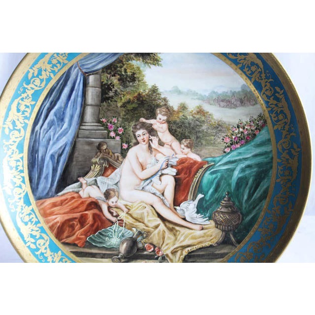 A large Vienna wall plaque, circa 1900. Decorated with a classical maiden (Possibly Venus) and cherubs in a pastoral...