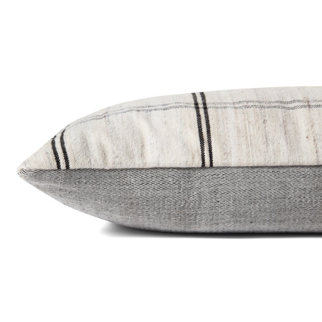 Throw pillows by Amber Lewis x Loloi take inspiration from heirloom textiles and earth-toned palettes to create an...