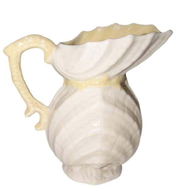 This Double Shell pattern cream jug is 3rd Mark Belleek Pottery, produced in Ireland, between 1926 and 1931. Belleek is...