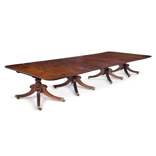 An exceptional and very large antique regency mahogany four pedestal dining table of outstanding quality and scale. The...