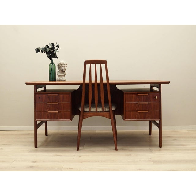 The desk was made in the 1970s by the renowned Danish manufacturer Omann Jun. Model No. 75. The structure and top are...