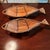 A pair of vintage rattan and bamboo fish baskets. The larger one measures 27” total length, 11.5” wide, and 4.5” high. The...