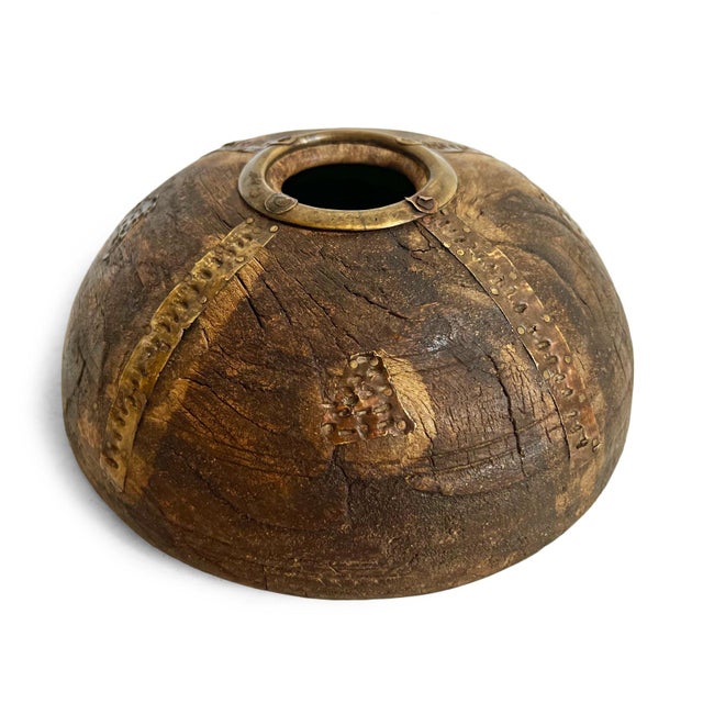 Antique old wooden tobacco container from India. Adorned with brass / metal decorative details. Each is unique and sold...