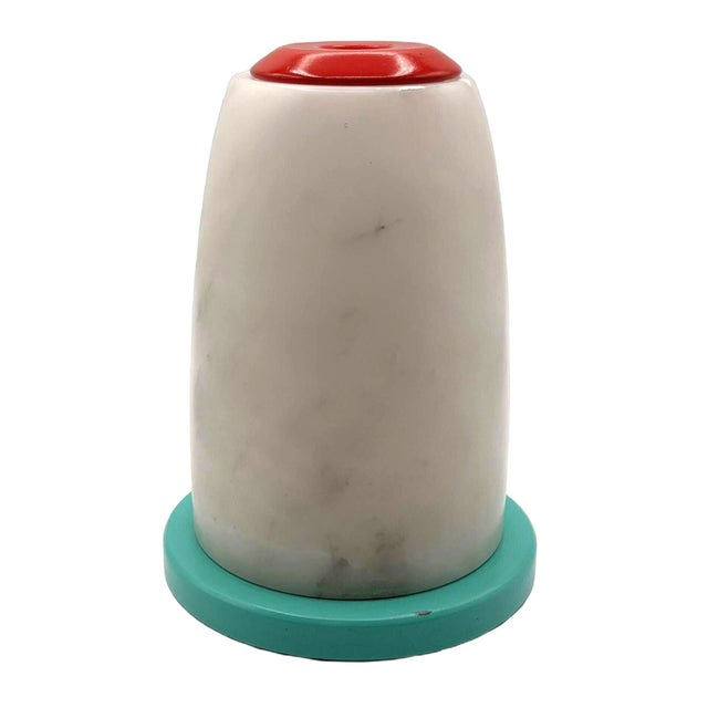 This Mid-century candlestick holder feature smooth, white alabaster holders paired with vibrant, colorful bases in...
