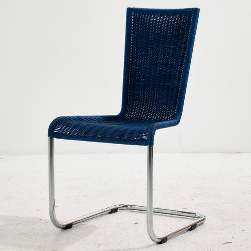 Tecta chair with woven seat and backrest from the 1980s. The chair provides comfortable seating thanks to its...