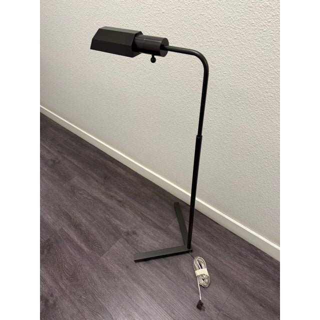 Handmade in America from solid brass, this minimalist floor lamp features a striking geometric design that brings a clean,...