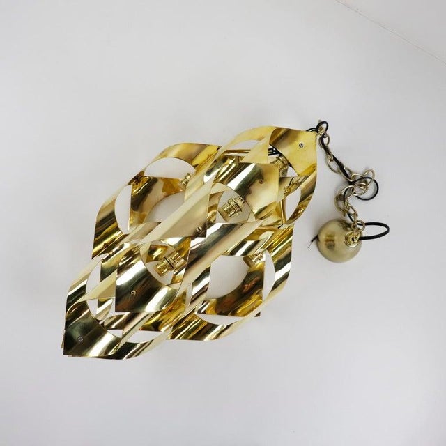 Circa 1960. We offer this Mid Century Italian Pendant Lamp. Beautiful design made in solid bronze plates. The lamp has...