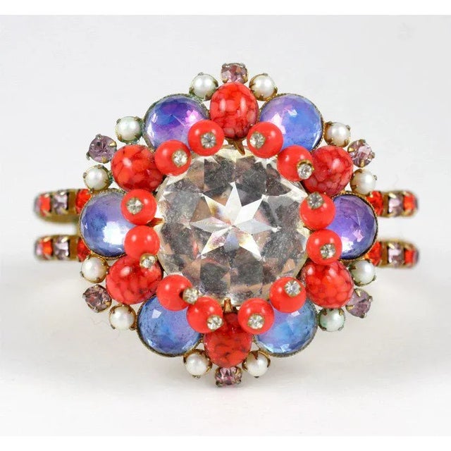 This is part of Chairish’s Costume Jewelry assortment. One giant brilliant cut rhinestone decorated with faux pearls, and...