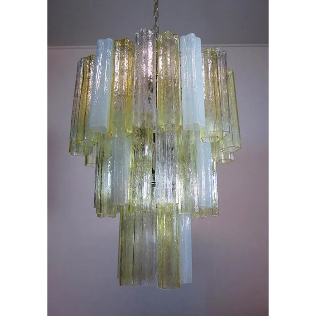 Italian vintage chandeliers in Murano glass and nickel-plated metal structure. The armor polished nickel supports 48 large...