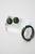 This vintage 1950's signed Weiss bakelite hinged bangle bracelet and clip on earrings set are set with green rhinestones....