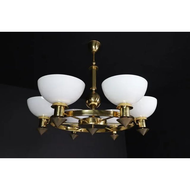 Xl brass and white opaline glass chandeliers, italy, 1970s this exceptional extra-large chandelier, crafted in italy...
