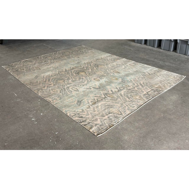 Design Plus Gallery presents an 8 ft 9 in × 11 ft 10 in Revias Mist Area Rug from Exquisite Rugs. The rug displays an...