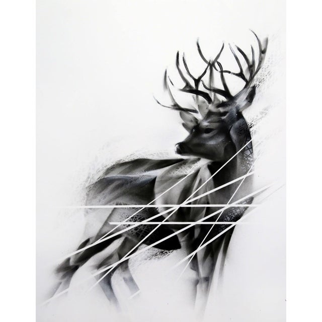 The artwork depicts a striking deer, rendered in a dynamic interplay of aerosol and acrylic techniques. The animal's form...
