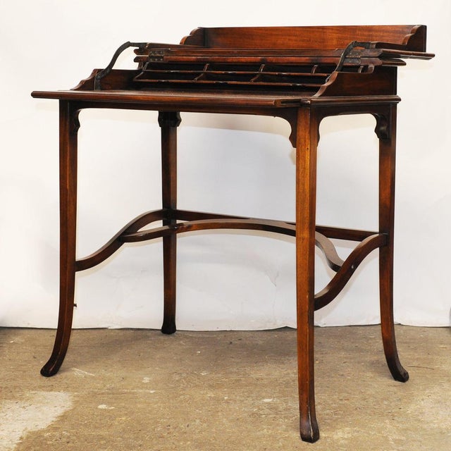 English Edwardian metamorphic writing table / desk, dating to circa 1905, with elegant Art Nouveau influence. Cleverly...