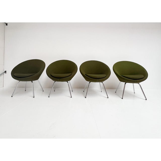 Modern lounge chair in dark green fabric by Allermuir, 2012. The comfortable saucer armchair, also called a UFO armchair,...