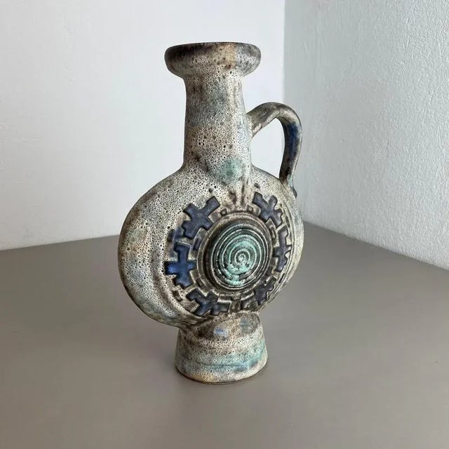 Article: Fat lava art vase Producer: Jopeko, Germany Design: Nr. 7101-32 Decade: 1970s : This original vintage vase was...