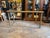 A vintage brass coffee table featuring sculptural overlapping leaf detailing, designed in the style of Maison Jansen. The...