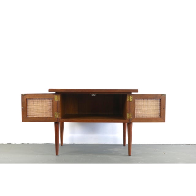 Gorgeous mid century modern design. This fully refinished table displays stunning old growth walnut grain with well...