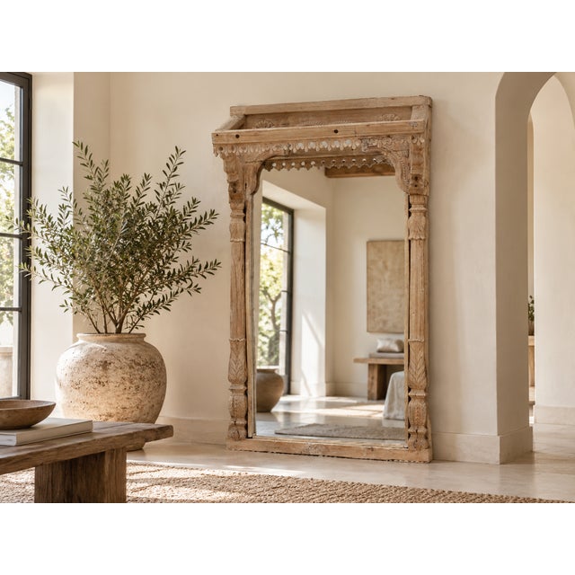 This is a truly special piece – a mirror that carries the weight of architectural history. Crafted from an antique Indian...