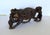 Large hand carved African Ironwood sculpture depicting a male and female lion attacking a Cape Buffalo. Amazing detail....