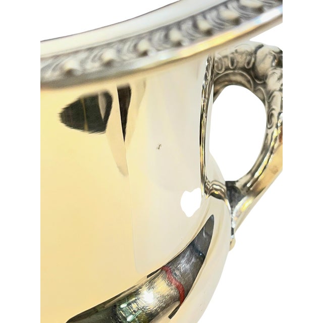 Elevate your home bar or next gathering with this striking mid-20th-century silver ice bucket by Leonard. Striking a...