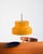 Curved body in mustard yellow lacquered metal with a white concentric diffuser. "Bumling" model by Anders Pehrson for...