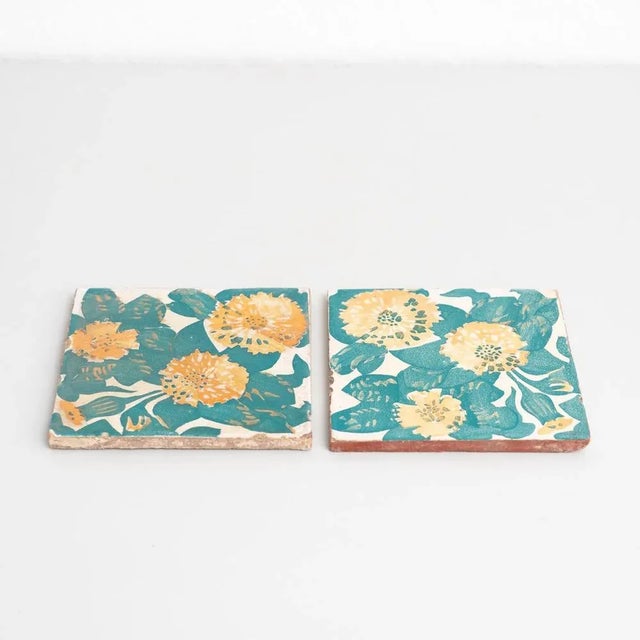 Decorative ceramic tiles by Antoni Gaudi, inspired by the marigold and dianthus motifs on the decorative ceramic tiles he...