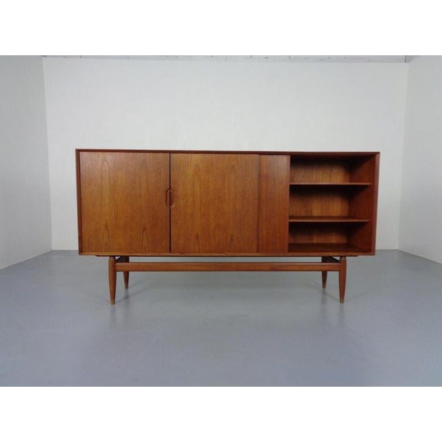 High quality processed, Danish teak sideboard by Henry Rosengren Hansen for Brand Møbelindustri. Four sliding doors. On...