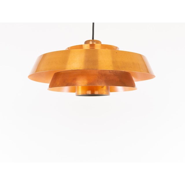 Copper Nova pendant, designed by Jo Hammerborg, who was the main designer of Danish lighting manufacturer Fog & Mørup in...
